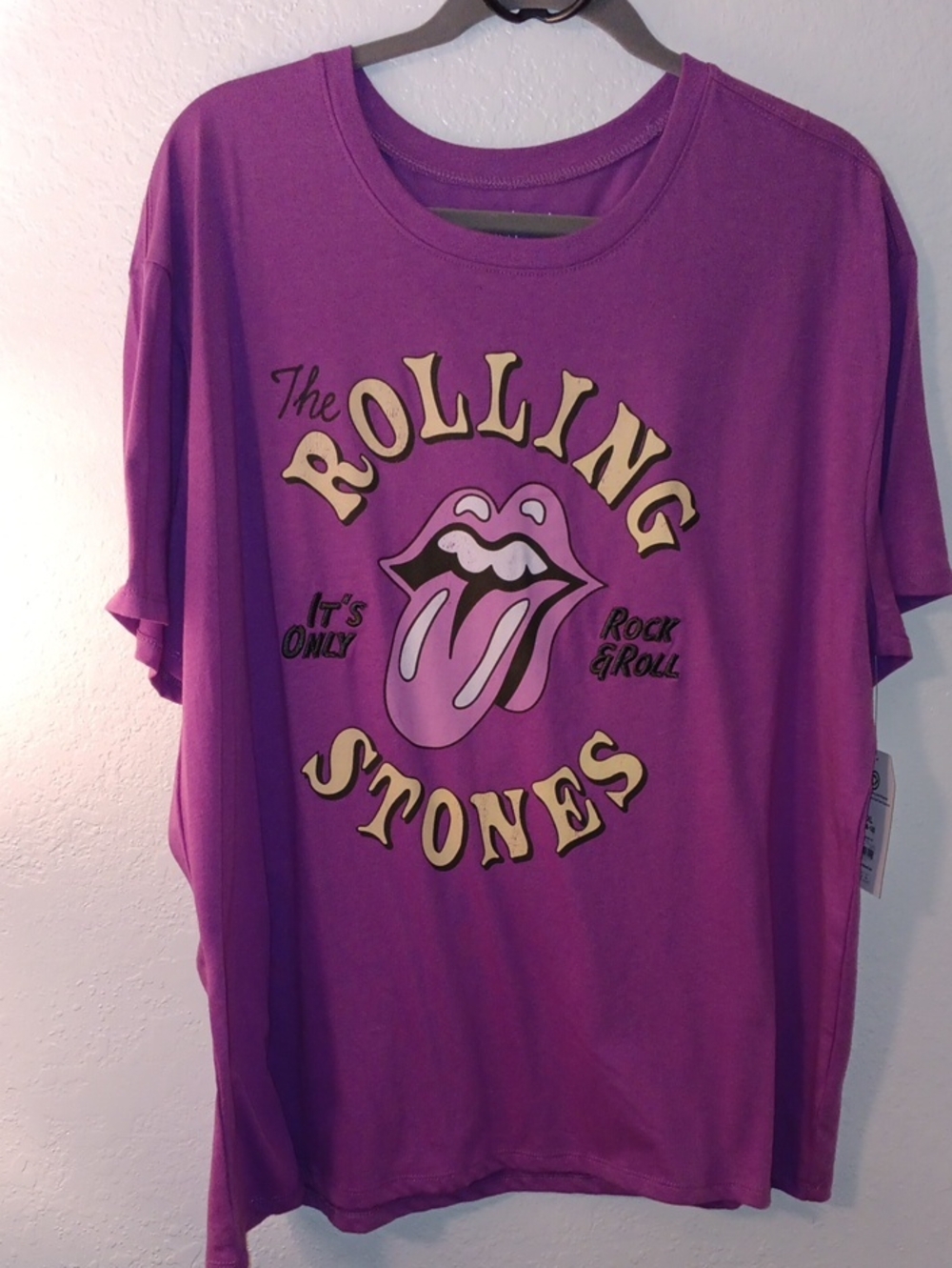 the Rolling Stones Purple Graphic Tee with Yellow Lettering and Pink Tongue